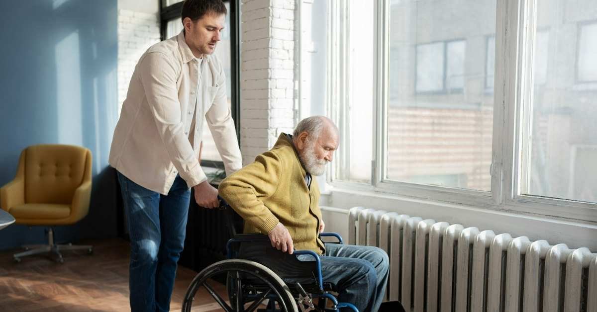 Special needs home care in Michigan providing disability care support as a professional caregiver assists a senior using a wheelchair safely at home.