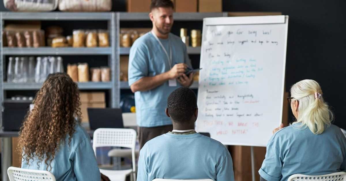 Home care staff training session with caregivers learning safety standards and caregiving skills in a professional Michigan home care setting